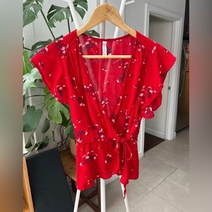 Red front wrap top with pink flower details, size S